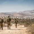 IDF soldiers block the way for Palstinian Olive farmers near the village of Salem in the West Bank, October 2012 (1) (1)