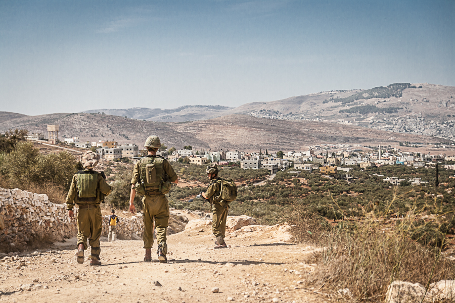 IDF soldiers block the way for Palstinian Olive farmers near the village of Salem in the West Bank, October 2012 (1) (1)